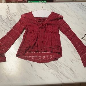 A burgundy lace blouse